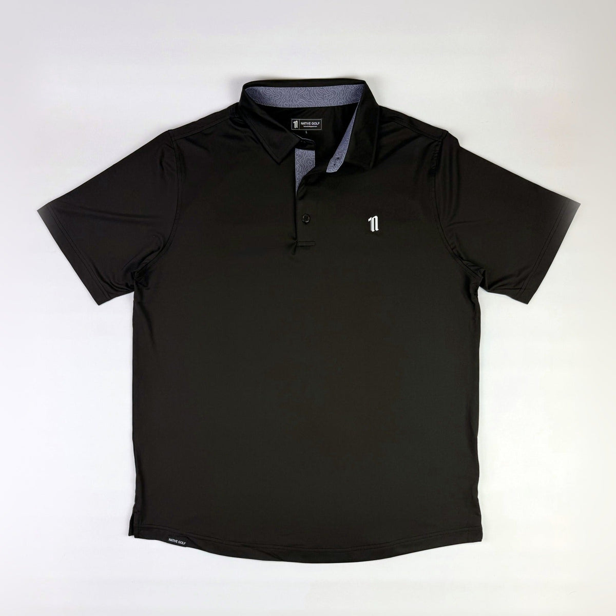 The Caddie Polo, black, laid flat front view