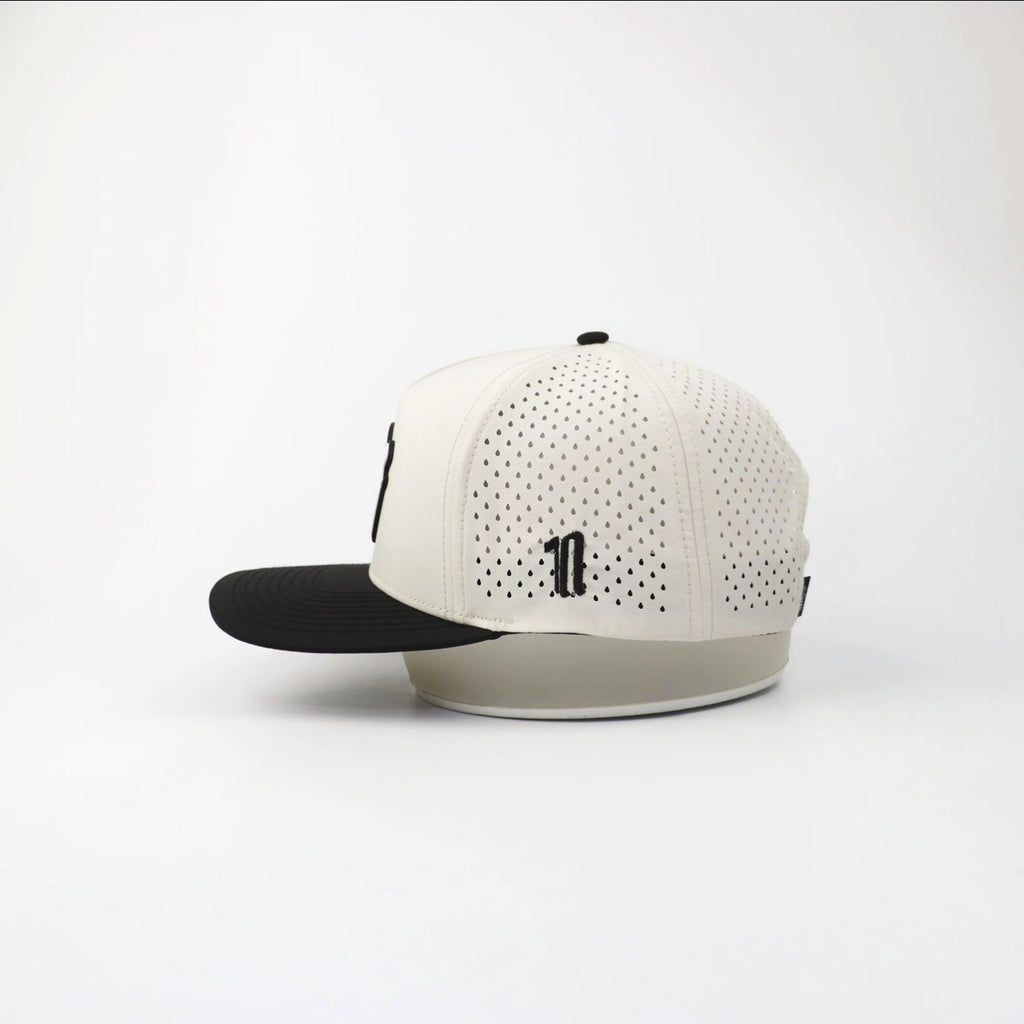 The Eagle "FULL SEND" hat, side view showing the laser-cut perforations
