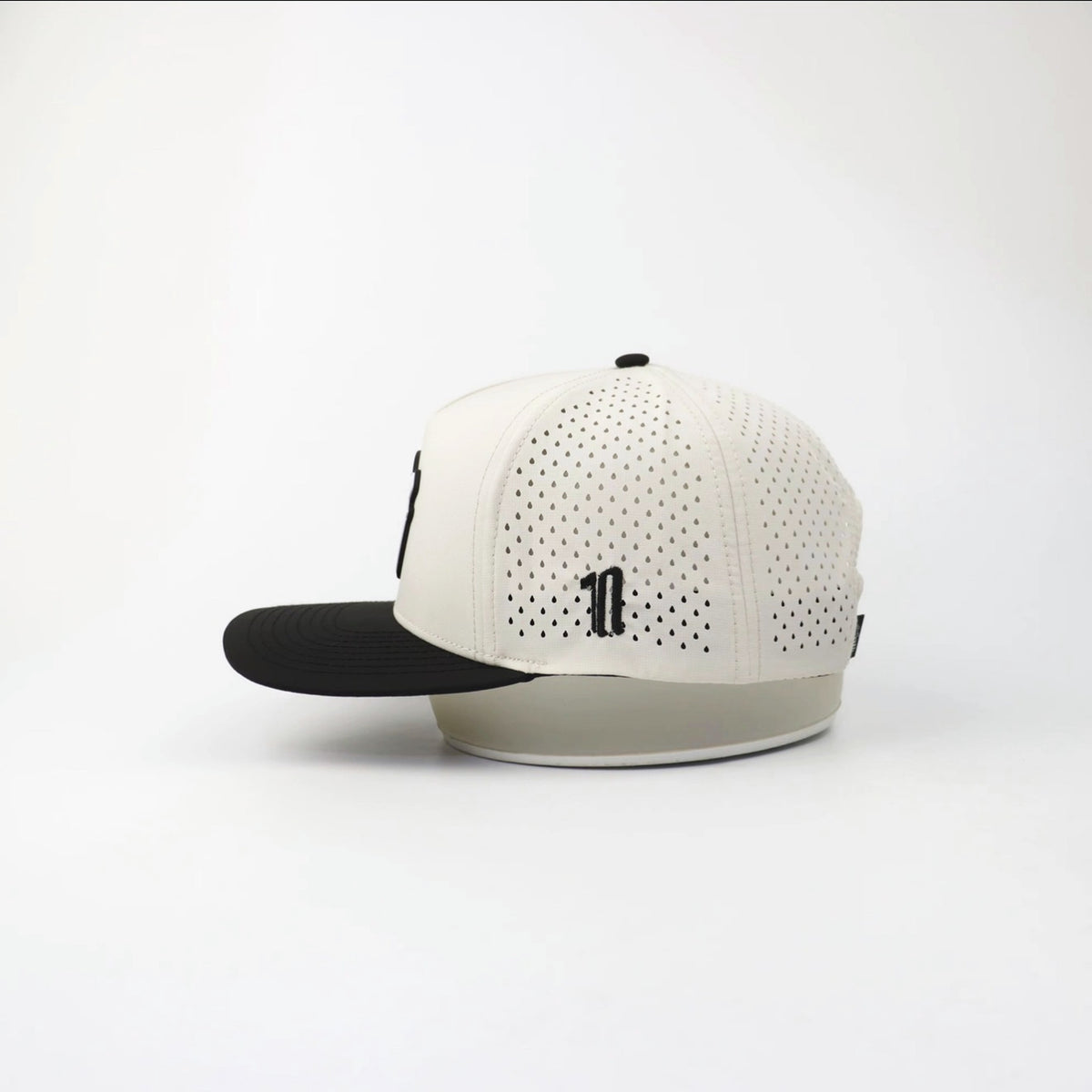 The Eagle "FULL SEND" hat, side view showing the laser-cut perforations