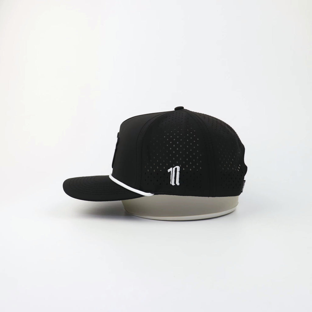 The Eagle "LIGHTS OUT" hat, side view showing the laser-cut perforations