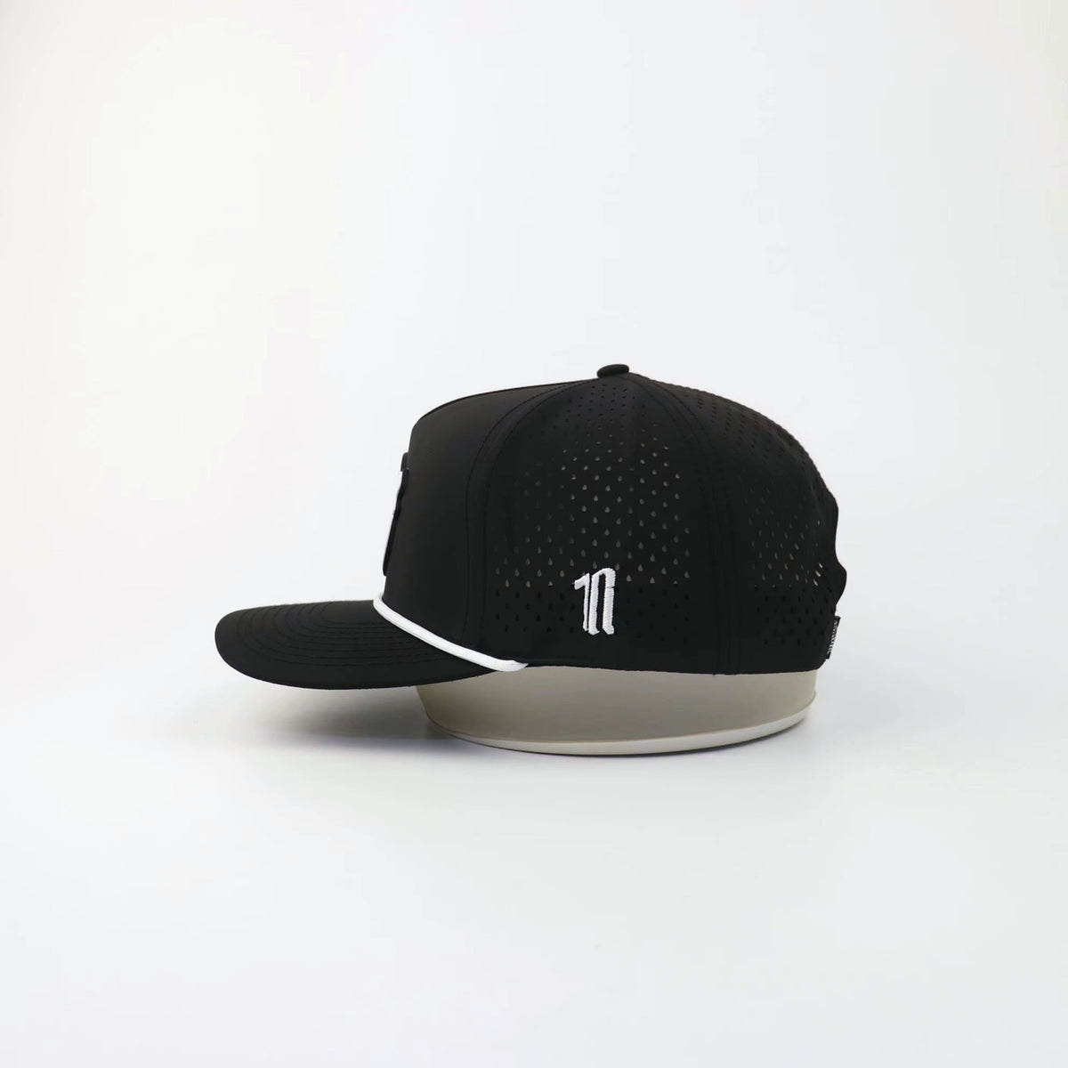 The Eagle "LIGHTS OUT" hat, side view showing the laser-cut perforations