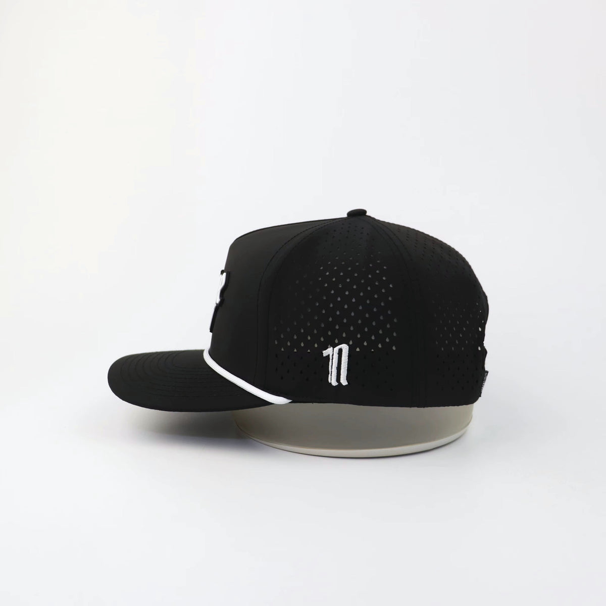 The OG- Black hat, side view showing the laser-cut perforations